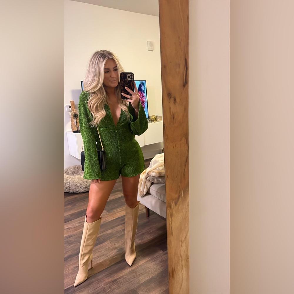 Green sparkly long sleeve romper. Worn once. Size small